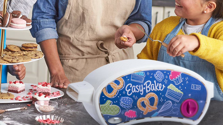 Family making treats with Easy-Bake Oven