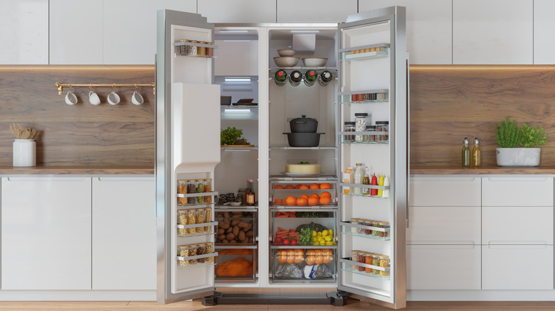 Open refrigerator packed with food