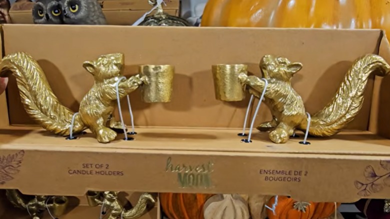 Set of gold squirrel shaped taper holders in box