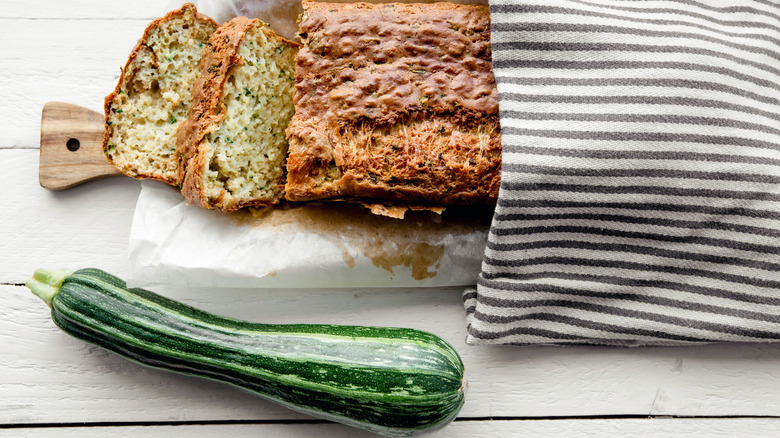 Sliced zucchini bread with whole zucchini