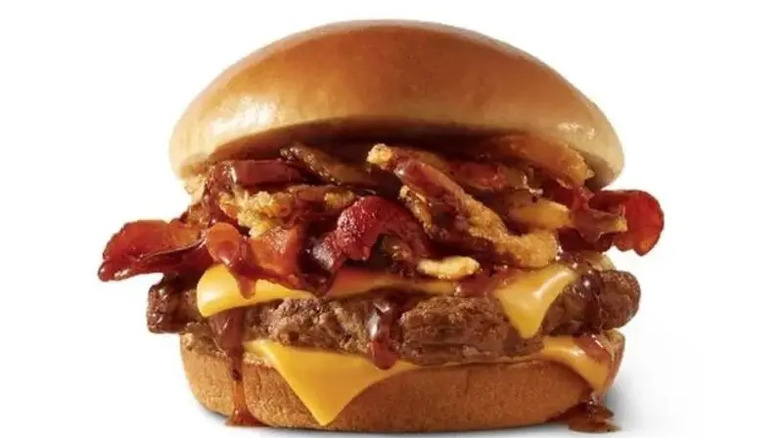 A Wendy's BBQ Bacon Cheeseburger with crispy onions and dripping sauce.