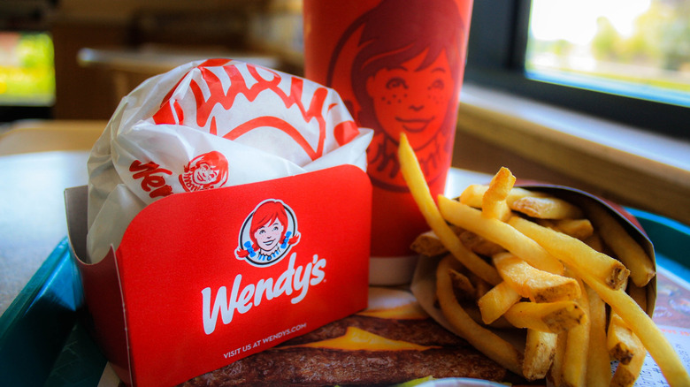 A Wendy's meal on a tray, with the sandwich still wrapped