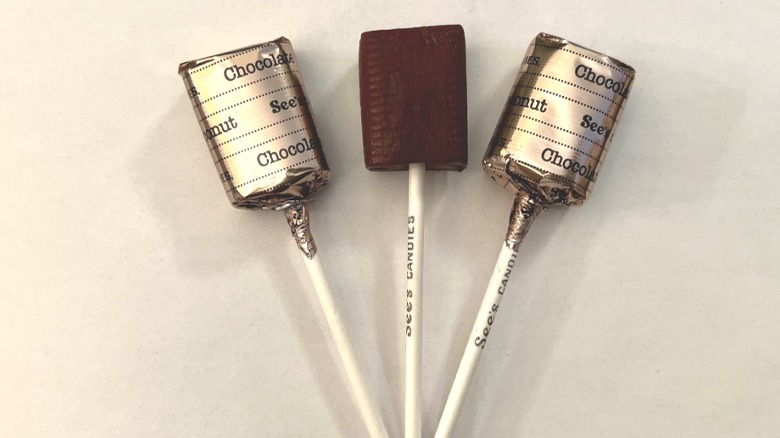 three See's Chocolate Lollypops