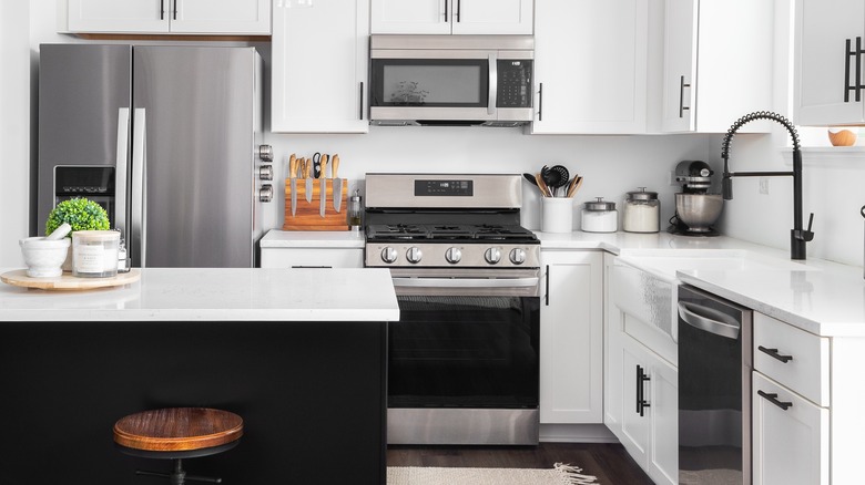 Clean countertops with appliances, knives and containers