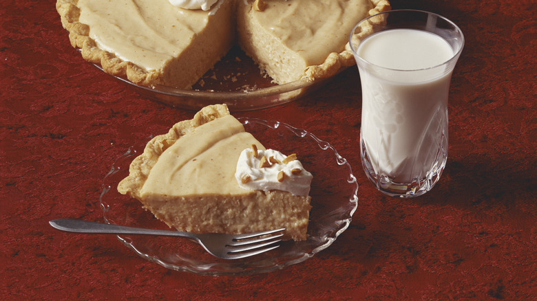 Peanut butter pie with milk and slice