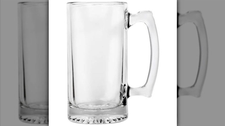 Clear glass mug on white background
