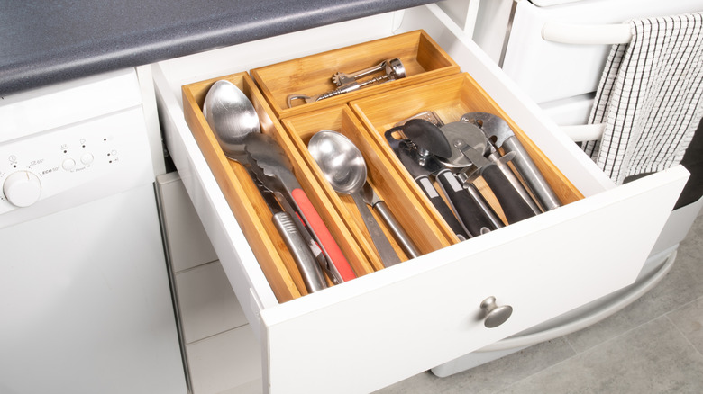 Kitchen drawer with modular organizer holding cookware