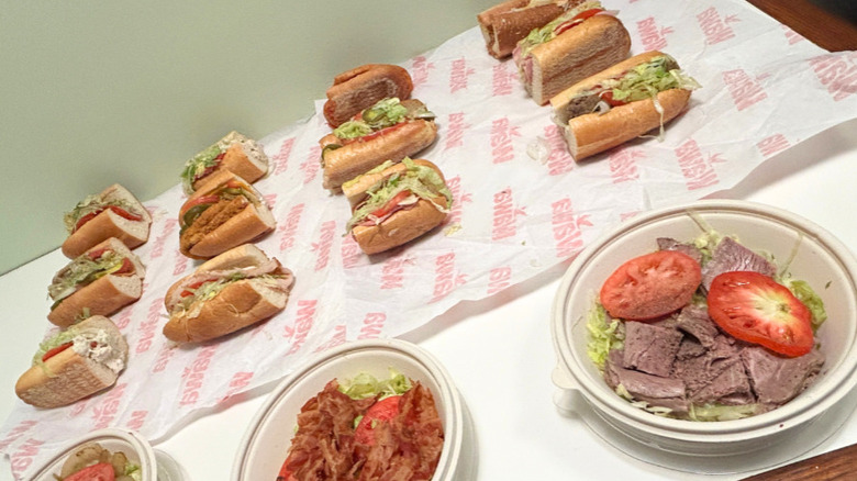 Close up of several hoagies and no-bun hoagies from Wawa