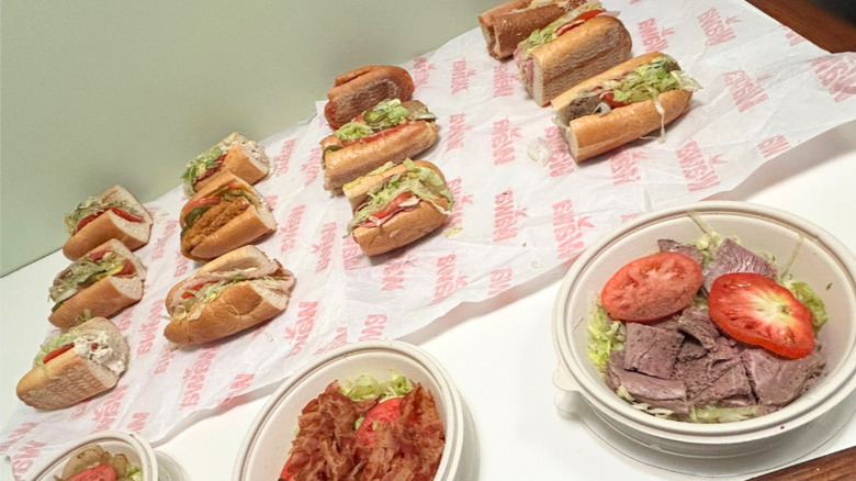 Close up of several hoagies and no-bun hoagies from Wawa