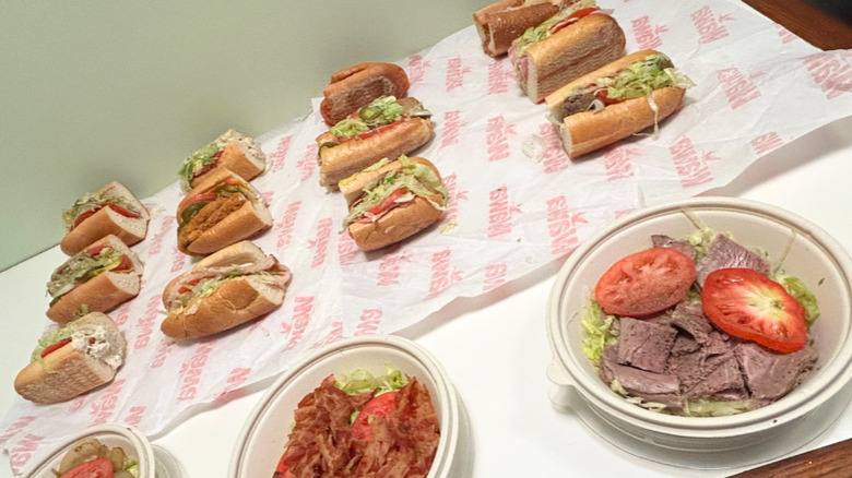 Close up of several hoagies and no-bun hoagies from Wawa