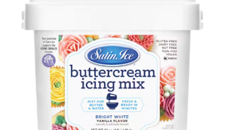 A tub of Satin Ice vanilla buttercream icing mix against a white background