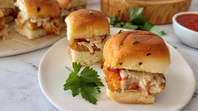 Chicken parmesan sliders on plate with parsley