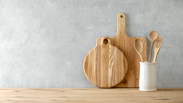 Wooden cutting board and utensils