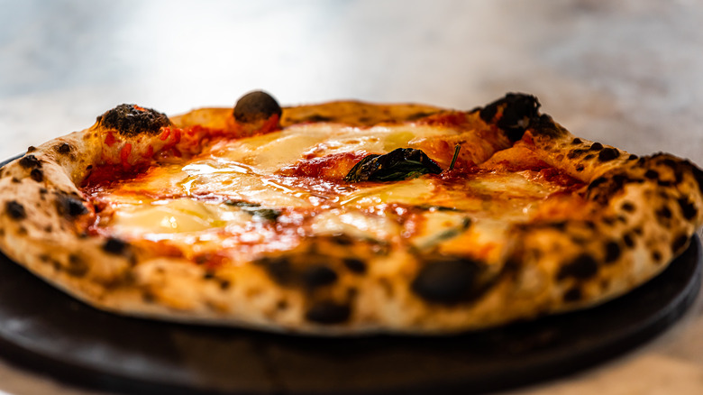 Pizza with charred crust