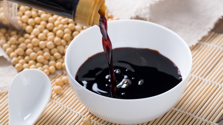 Soy sauce poured into bowl