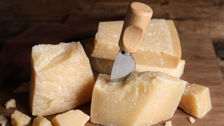 Hunks of Parmigiano Reggiano with cheese knife