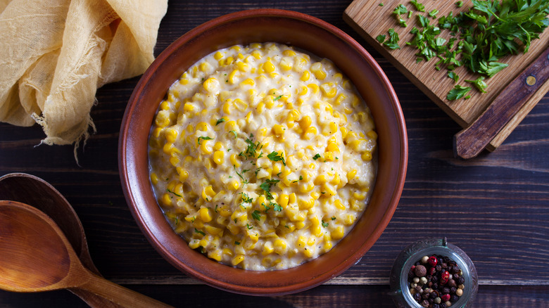 Bowl of corn chowder with spices and herbs