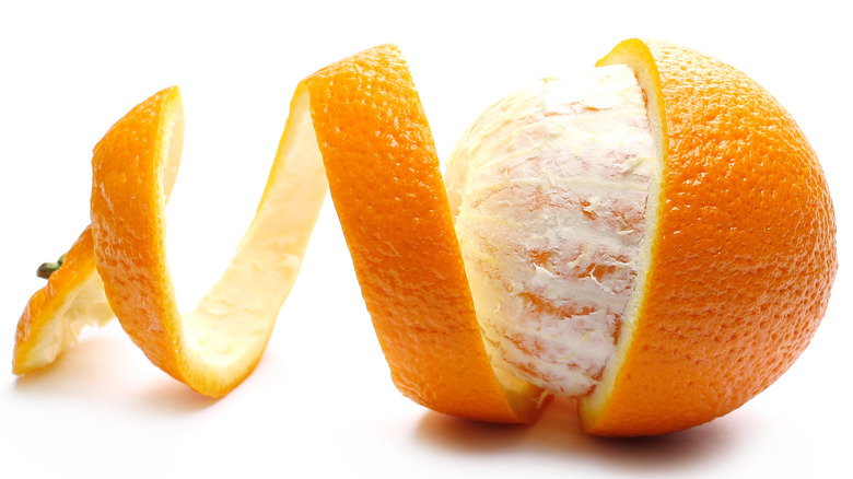 A partly peeled orange