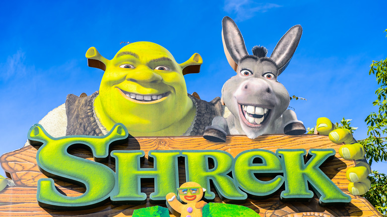 Shrek and Donkey over "Shrek" sign