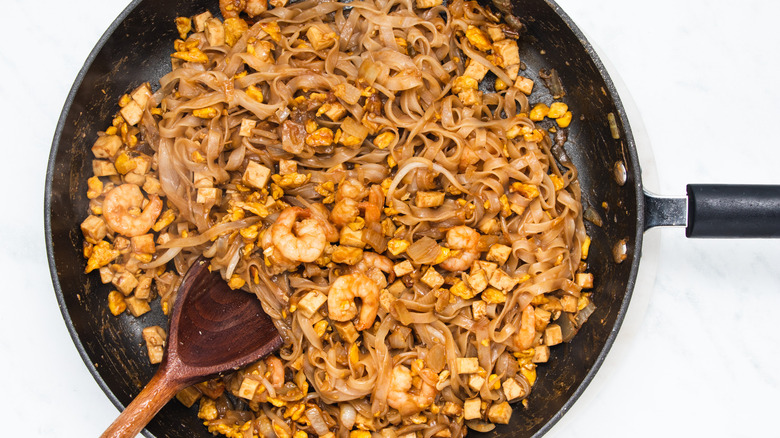 pad thai ingredients in pan