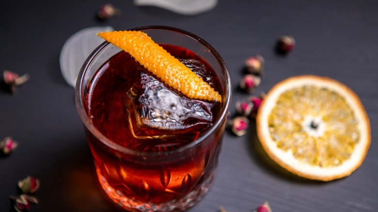 A Boulevardier cocktail with an orange garnish