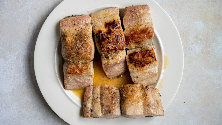 four fish fillets on plate