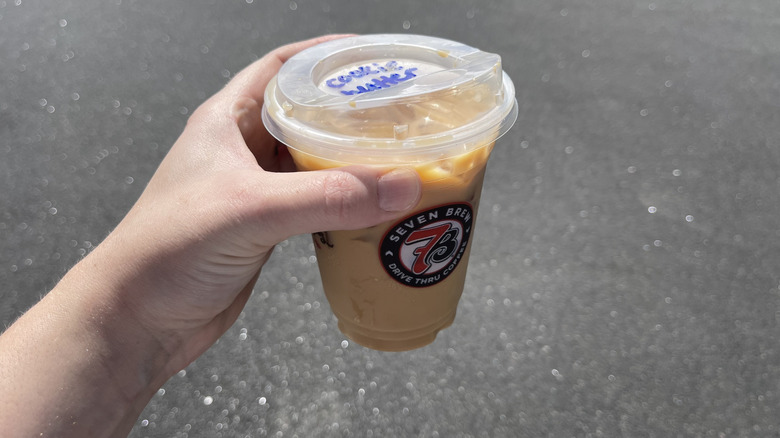 The Cookie Butter coffee from 7 Brew held in a hand