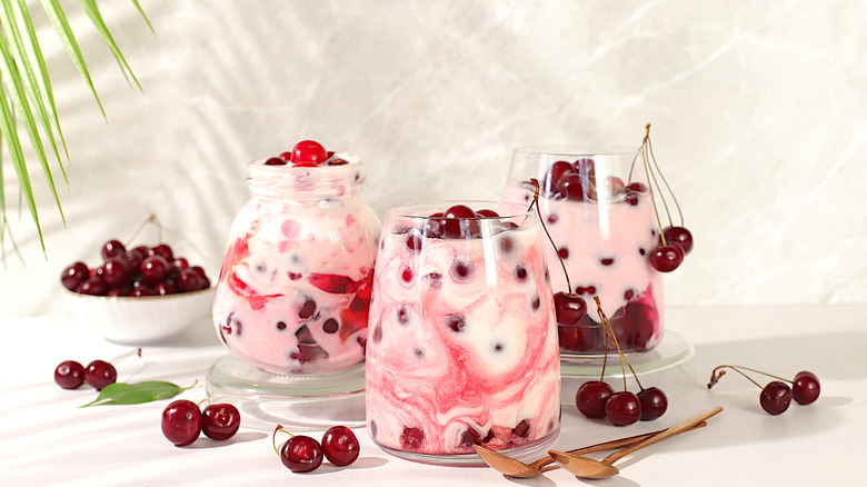 jars full of yogurt and cherries