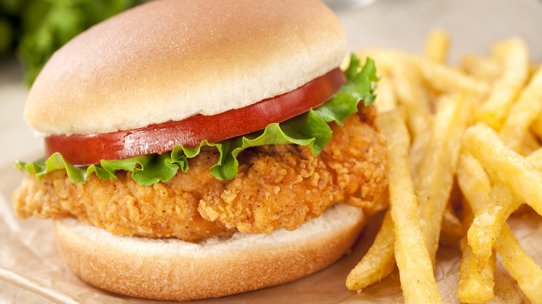 Fried chicken sandwich with fries.