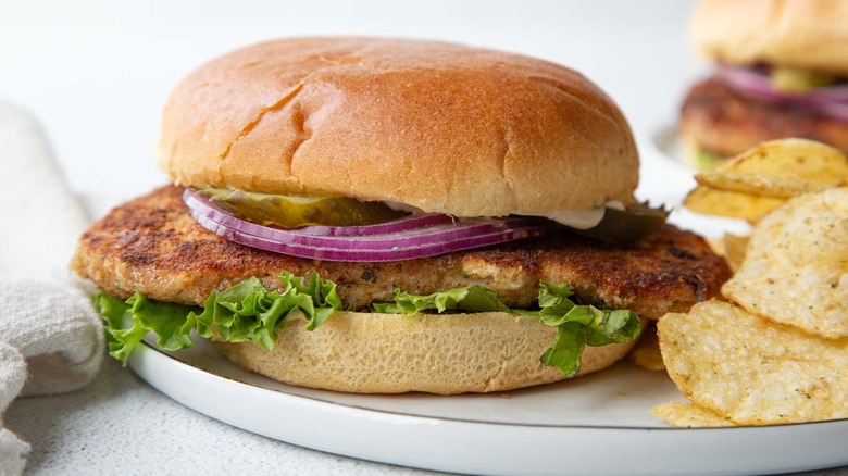 A fried pork chop sandwich.