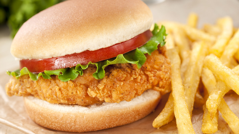 Fried chicken sandwich with fries.