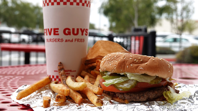 Five Guys burger with fries and a milkshake