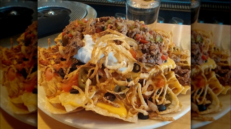 Sloppy Joe nachos topped with fried onions