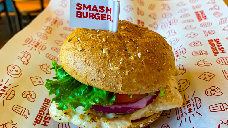 Smashburger breakfast sandwich on branded paper