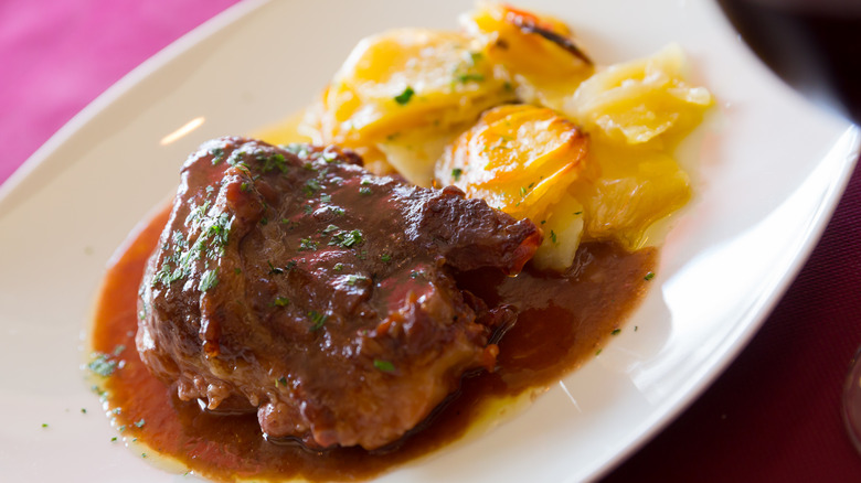 Steak and potatoes with sauce
