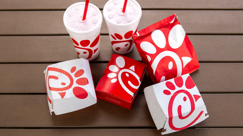 Top-down view of Chick-Fil-A packaging on a picnic table.