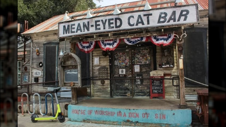 Scooter parked outside of Mean-Eyed Cat bar