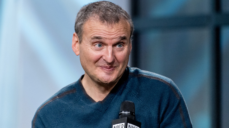 Phil Rosenthal smiling with microphone