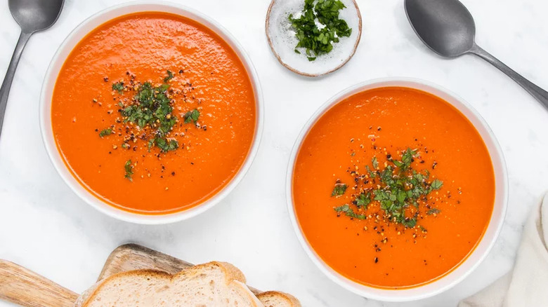 Two bowls of tomato soup