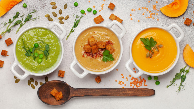 Assorted colorful bowls of soup