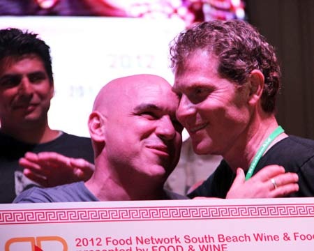 Chef Bobby Flay congratulates winner Michael Symon.