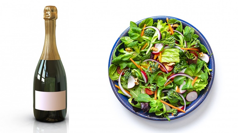 champagne bottle and bowl of salad