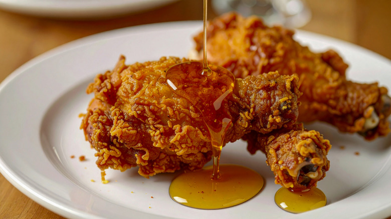 A plate of Florida State fried chicken with honey