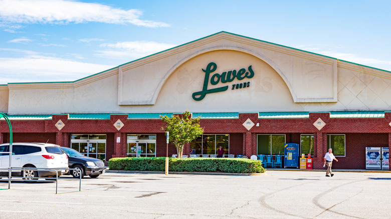 Parking lot view of a Lowes Foods storefront on a sunny day