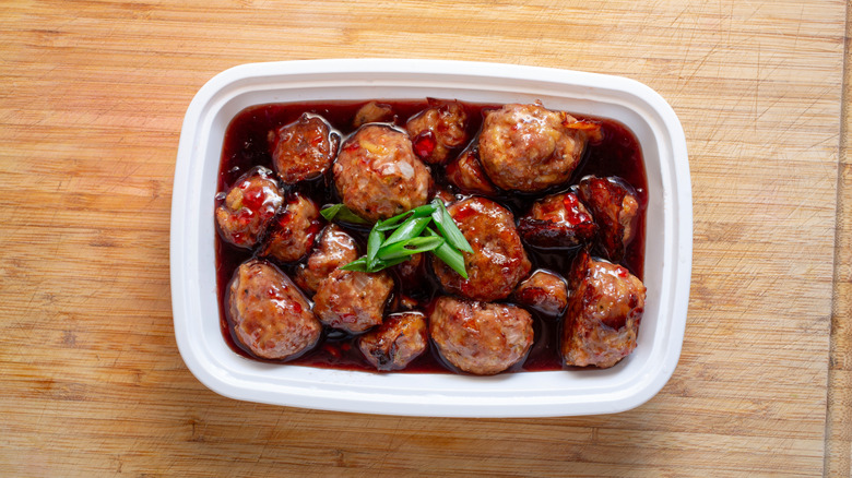 Container of grape jelly meatballs
