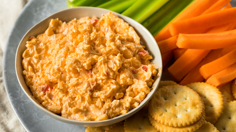 Pimento cheese spread with crackers and vegetables