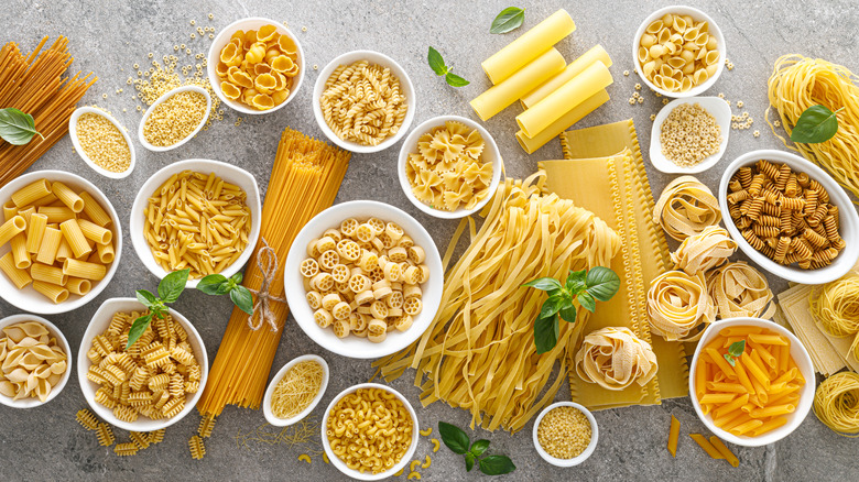 Different pasta shapes in bowls