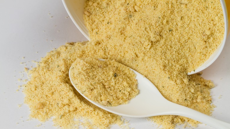 Bouillon powder on white spoon