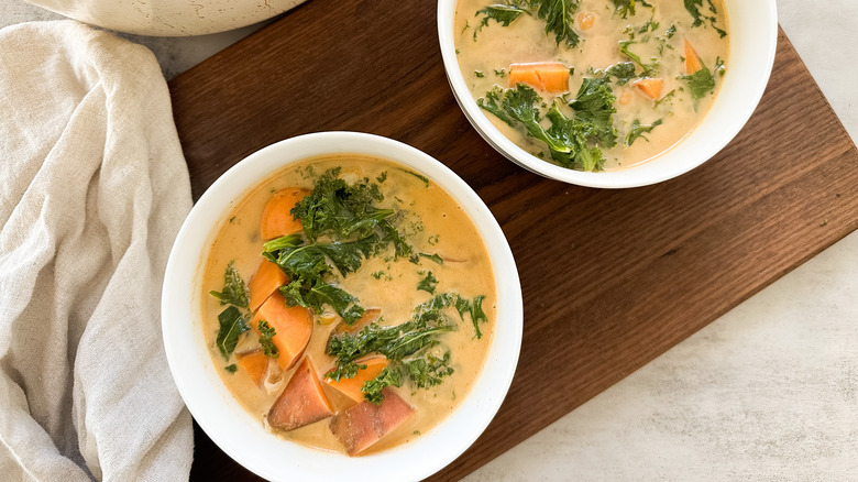 spiced sweet potato and kale stew in bowls
