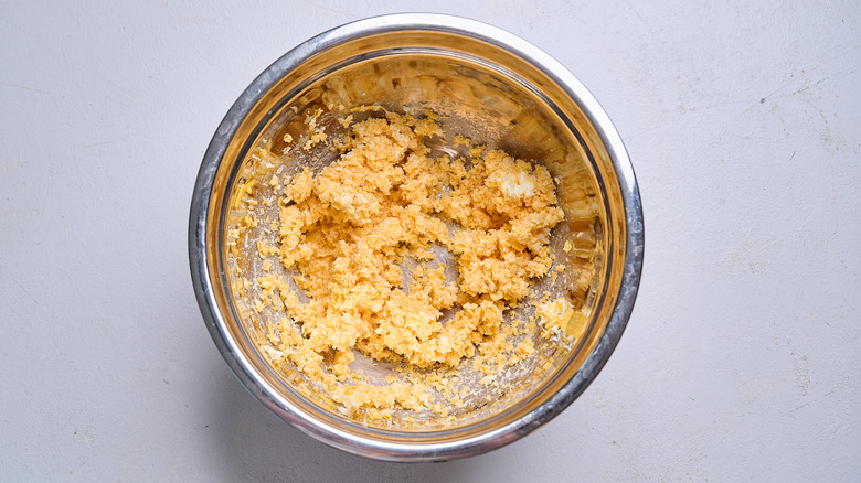 butter and cheese beaten together in a bowl